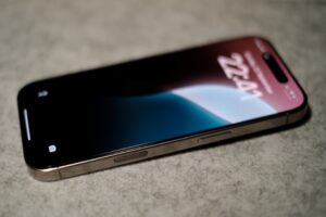 A close-up view of the latest iPhone 16 Pro with camera button, showcasing its elegant design and advanced features