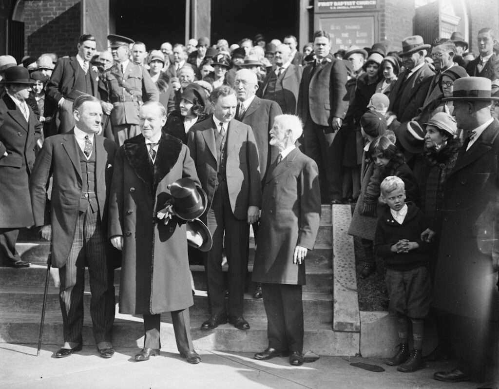 President and Mrs. Coolidge attended Thanksgiving Day service at the First Baptist Church in Virginia. Glass negative by Harris & Ewing, 1928. Library of Congress Prints & Photographs Division. Photograph shows, left to right: Governor Angus McLean of North Carolina; President Coolidge; Mrs. Coolidge; Governor Harry Byrd of Virginia; Rev. George L. Petrie of the Charlottesville Ministerial Associate; and Rev. J.W. Moore, Pastor of the First Baptist Church. https://www.loc.gov/item/2016889105/