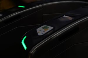 A mass rapid transit (MRT) gate that accepts contactless cards, digital wallets, EZ-Link cards and NETS cards.